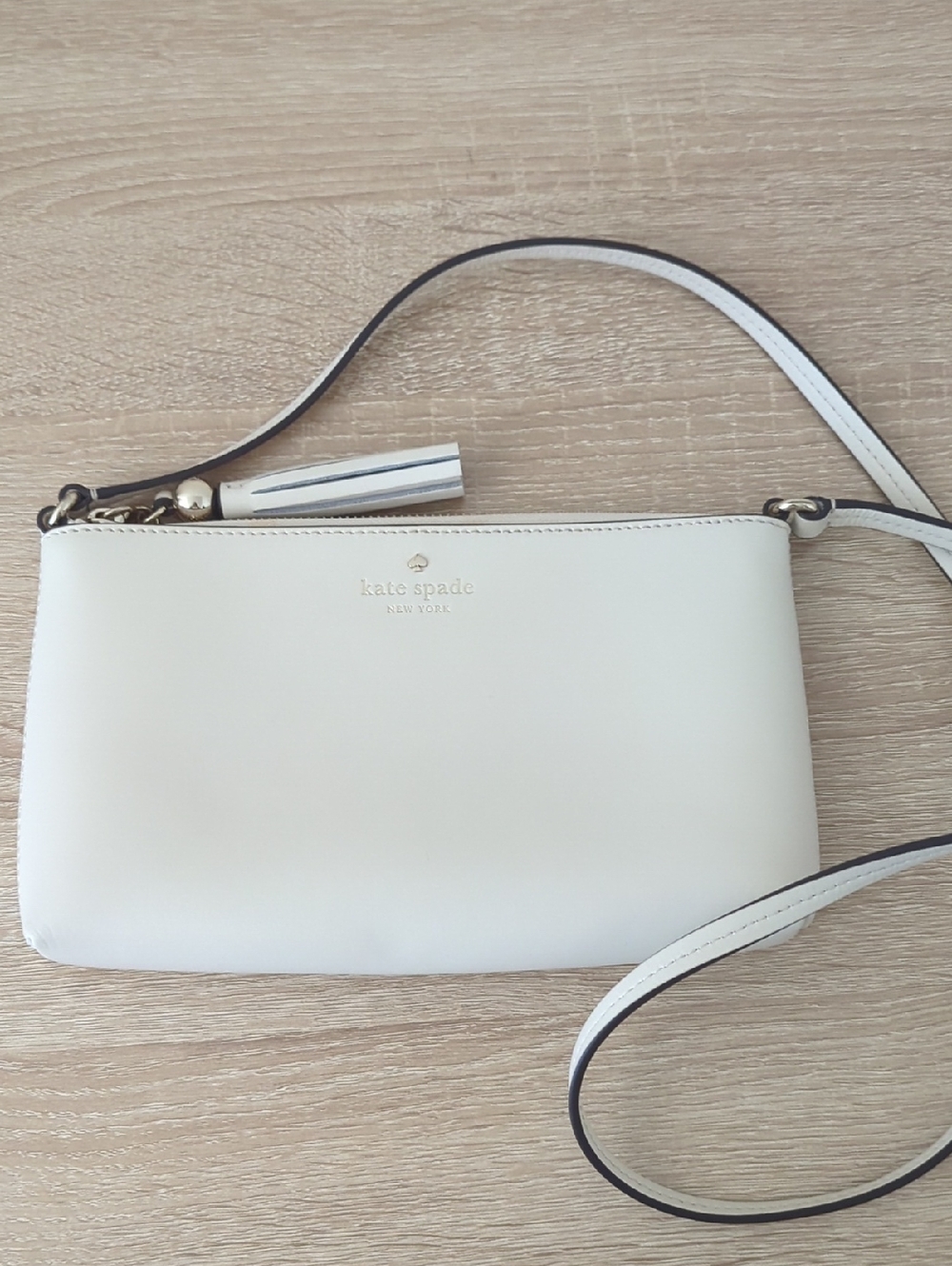 kate spade cream leather crossbody with tassel